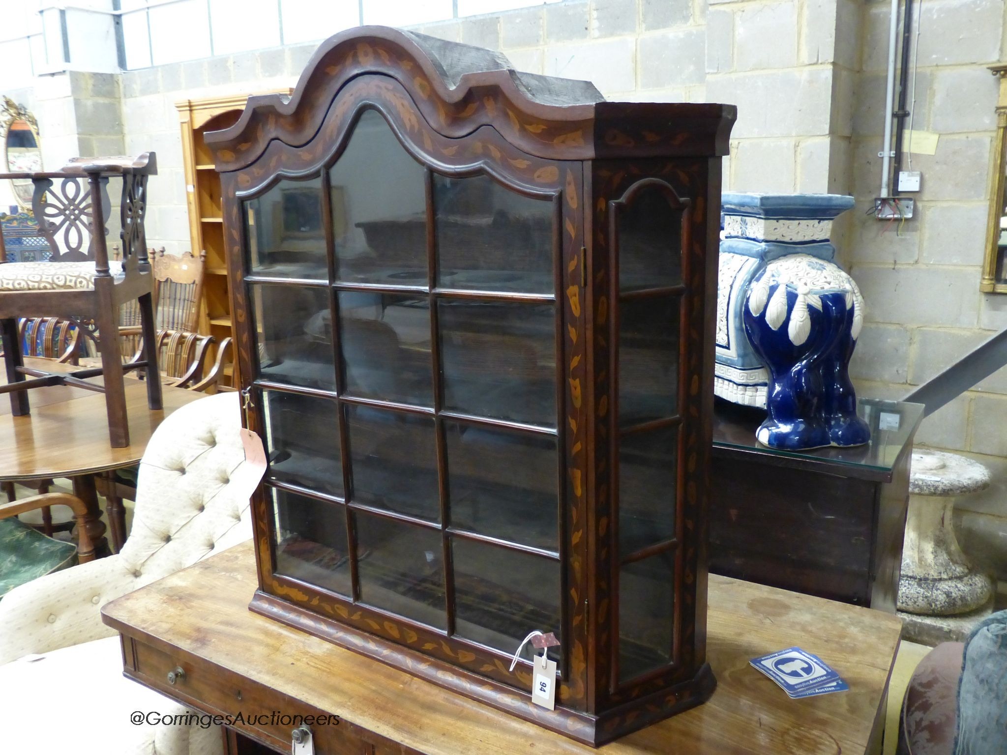 An early 19th century Dutch floral marquetry inlaid walnut and mahogany hanging display cabinet, width 86cm, depth 22cm, height 92cm